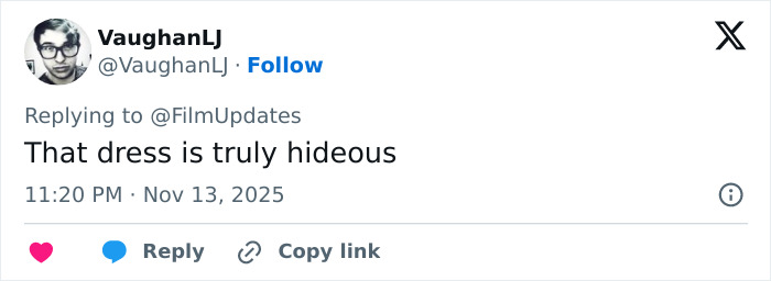 Screenshot of a tweet criticizing Michelle Yeoh&rsquo;s wasp nest inspired outfit at the premiere for being hideous.