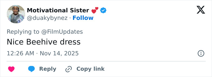 Michelle Yeoh at premiere wearing wasp nest inspired outfit triggering online meltdown and fashion debates.