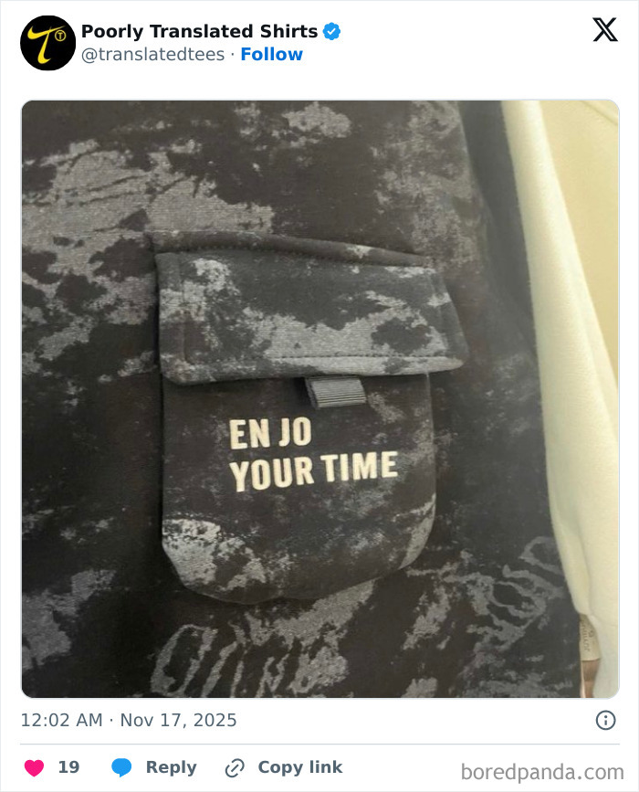 Black shirt pocket with a funny English translation saying "EN JO YOUR TIME" in white text, showcasing humorous t-shirts worldwide.