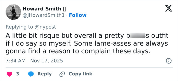 Tweet screenshot showing a user defending a singer&rsquo;s inappropriate outfit during the US National Anthem at NFL game.