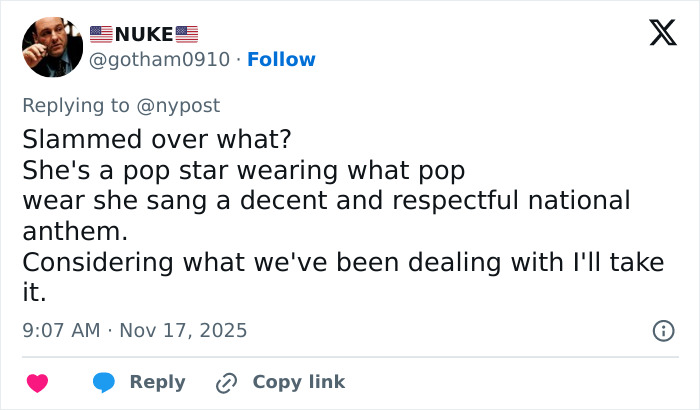 Screenshot of a social media post defending a singer criticized for wearing an inappropriate outfit during the NFL national anthem.