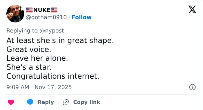 Screenshot of a tweet defending a singer criticized for an inappropriate outfit during the US national anthem at an NFL game.
