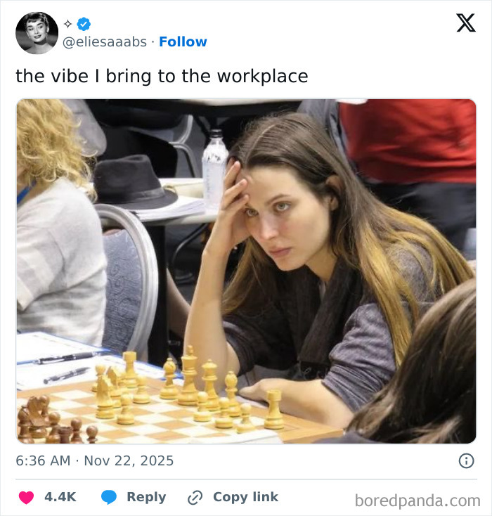 Young woman focused and thoughtful playing chess, illustrating the vibe of having a job and workplace challenges.