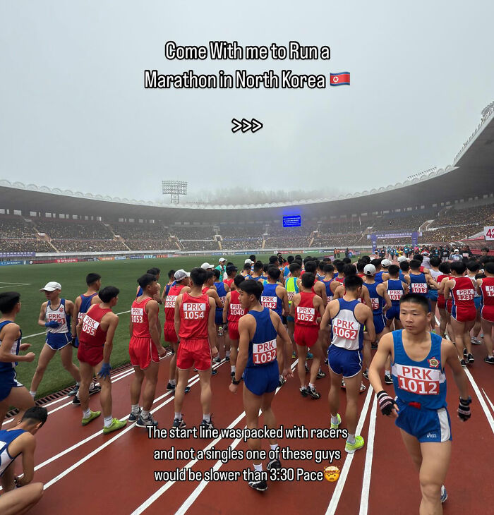 Runners at the start line of a marathon in North Korea, showcasing a unique athlete gathering and race event.