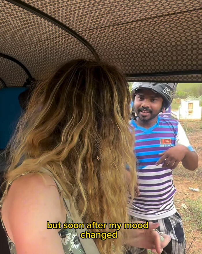 Woman revealing disturbing truth about solo traveling, interacting with a local man inside a vehicle during daytime.