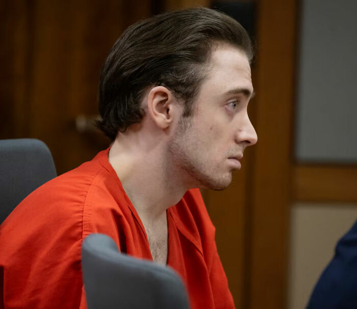 Man in red prison uniform in court, facing forward, in disturbing Alaska case involving fatal attack on 19-year-old girl. Man in red prison uniform in court, facing forward, in disturbing Alaska case involving fatal attack on 19-year-old girl.