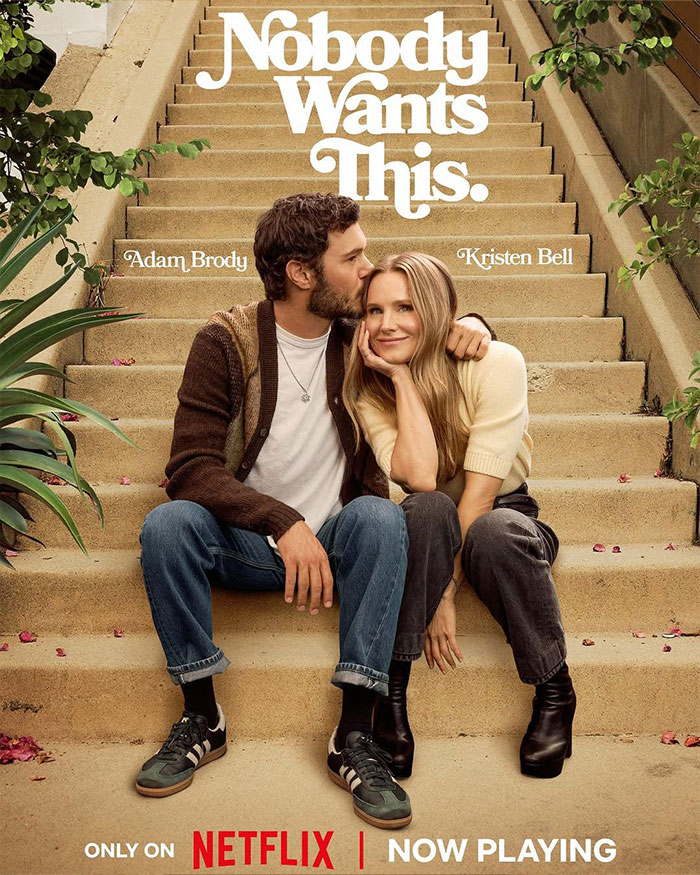 Couple sitting on outdoor steps with Kristen Bell, highlighting outrage after joining Fox Faith Project in media news.