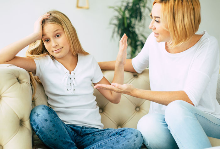 A mother confronting her daughter on a couch, illustrating an Oscar-worthy performance of telling lies and denial.