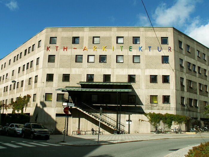 Modern architecture showing an unesthetic and ugly building with a dull facade and small square windows.