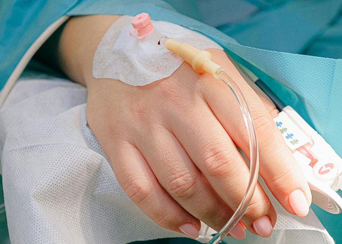 Close-up of a hand with an intravenous line, illustrating common knowledge that is surprisingly not so common.