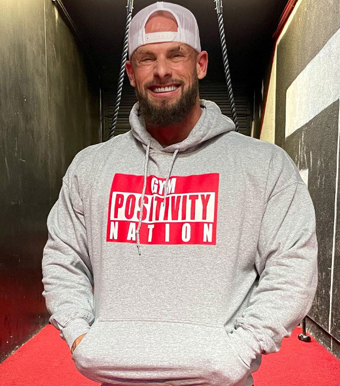 Joey Swoll wearing a hat and Gym Positivity Nation hoodie, weighing in on Gold's Gym trans locker controversy. Joey Swoll wearing a hat and Gym Positivity Nation hoodie, weighing in on Gold's Gym trans locker controversy.