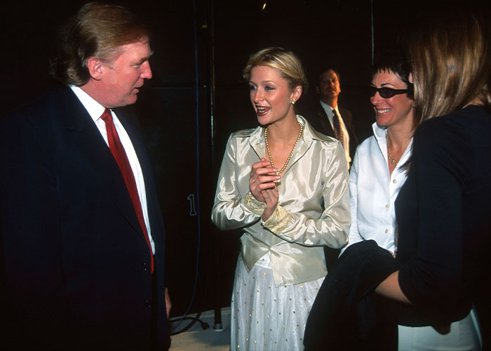Paris Hilton speaking with people at an event, linked to controversial Epstein rumors and Ghislaine Maxwell. Paris Hilton speaking with people at an event, linked to controversial Epstein rumors and Ghislaine Maxwell.
