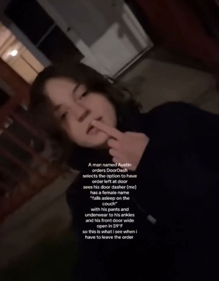 Person outdoors at night making a rude gesture, illustrating DoorDash driver arrested after recording undressed customer video. Person outdoors at night making a rude gesture, illustrating DoorDash driver arrested after recording undressed customer video.