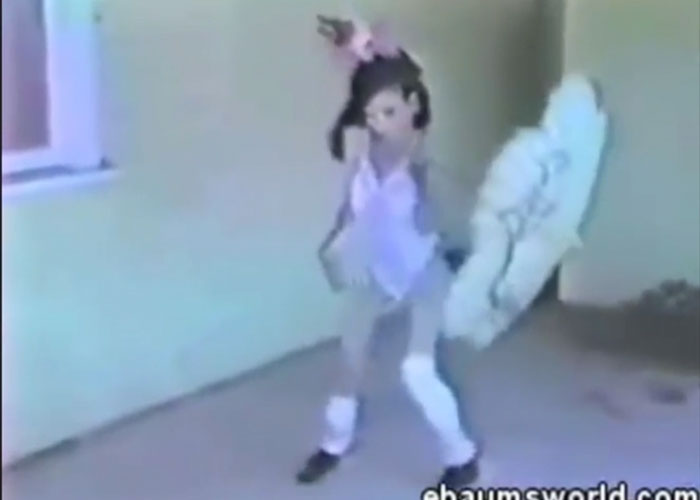 Blurry vintage video of a creepy doll dancing in a dimly lit room, one of the most terrifying things found online