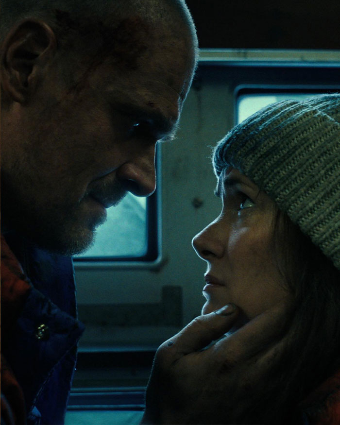 David Harbour and Stranger Things co-star share an intense close moment, highlighting their on-screen connection and chemistry.