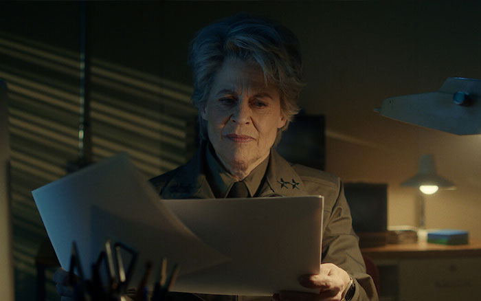 Linda Hamilton, 69, in a dimly lit room reviewing papers, reflecting on aging in Hollywood amid Stranger Things season 5. Linda Hamilton, 69, in a dimly lit room reviewing papers, reflecting on aging in Hollywood amid Stranger Things season 5.