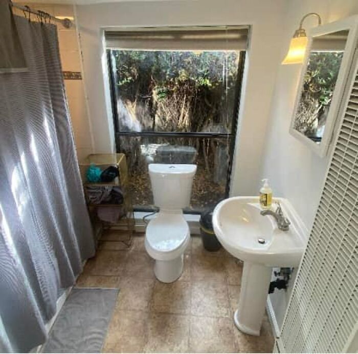 Bathroom in a unique Zillow home featuring a large window and modern fixtures you have to see to believe.