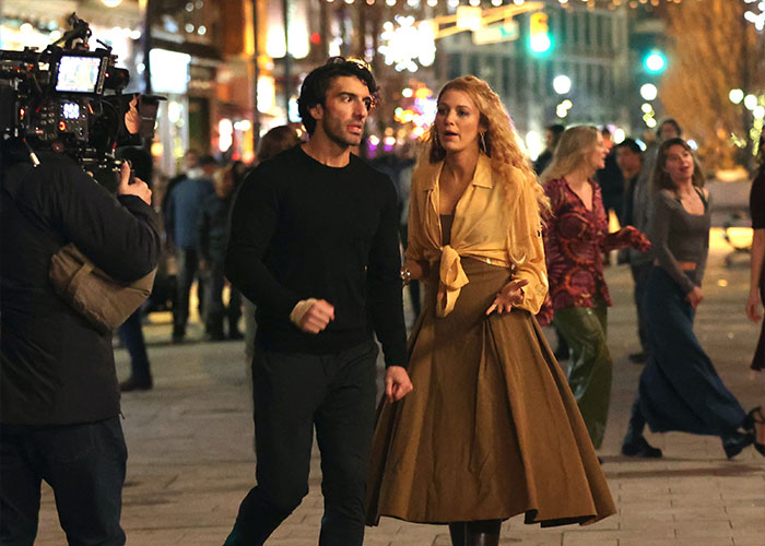 Justin Baldoni and Blake Lively on a city street at night during filming, highlighting a legal mistake in countersuit case.