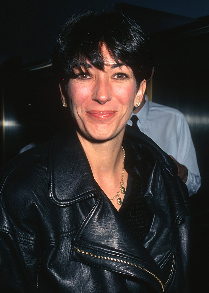 Ghislaine Maxwell smiling in a black leather jacket in a dim indoor setting, related to Epstein rumors coverage. Ghislaine Maxwell smiling in a black leather jacket in a dim indoor setting, related to Epstein rumors coverage.