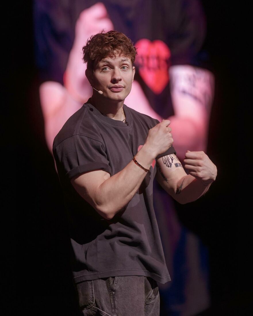 Matt Rife on stage during a big tour, showcasing tattoos and discussing net worth and career highlights. Matt Rife on stage during a big tour, showcasing tattoos and discussing net worth and career highlights.