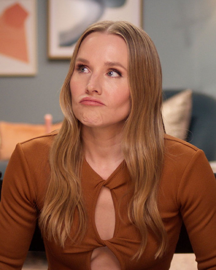 Kristen Bell with long hair and brown top making a pouting face, sparking outrage over Fox Faith Project involvement
