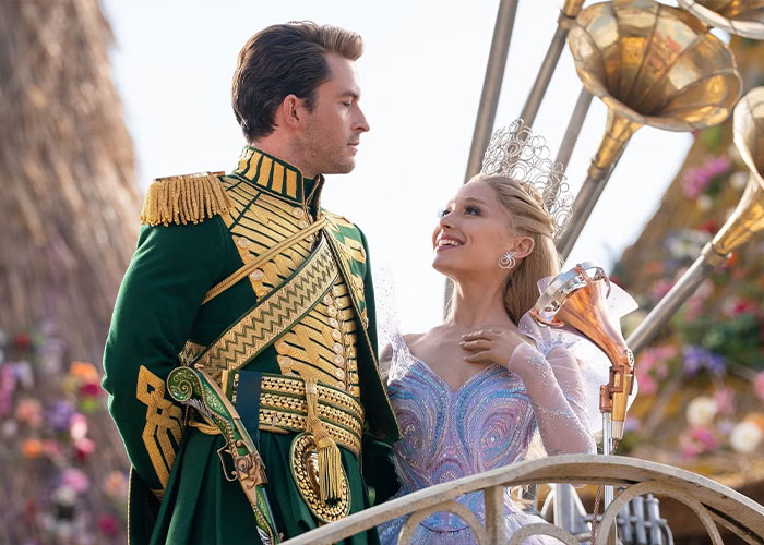 Ariana Grande and Jonathan Bailey in an intimate scene, sparking home wrecking jokes among fans.