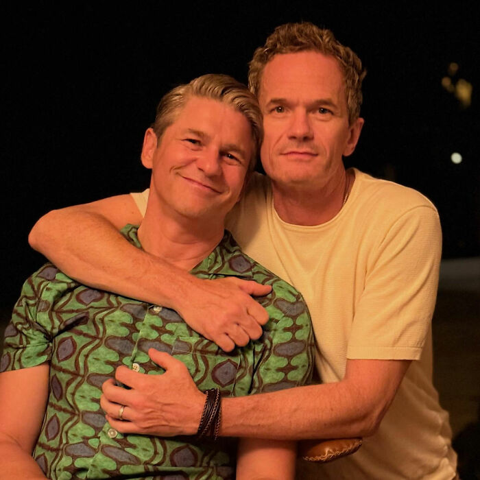Two men posing closely together at night, unrelated to Neil Patrick Harris' daughter Harper or Wicked premiere.