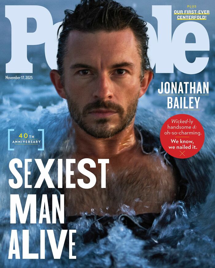 Jonathan Bailey on People magazine cover as sexiest man alive, wet hair and water surrounding his shoulders in ocean setting