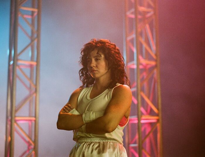 Sydney Sweeney on set with stage lighting, representing leaked PR emails and damage control after Christy box office disappointment.