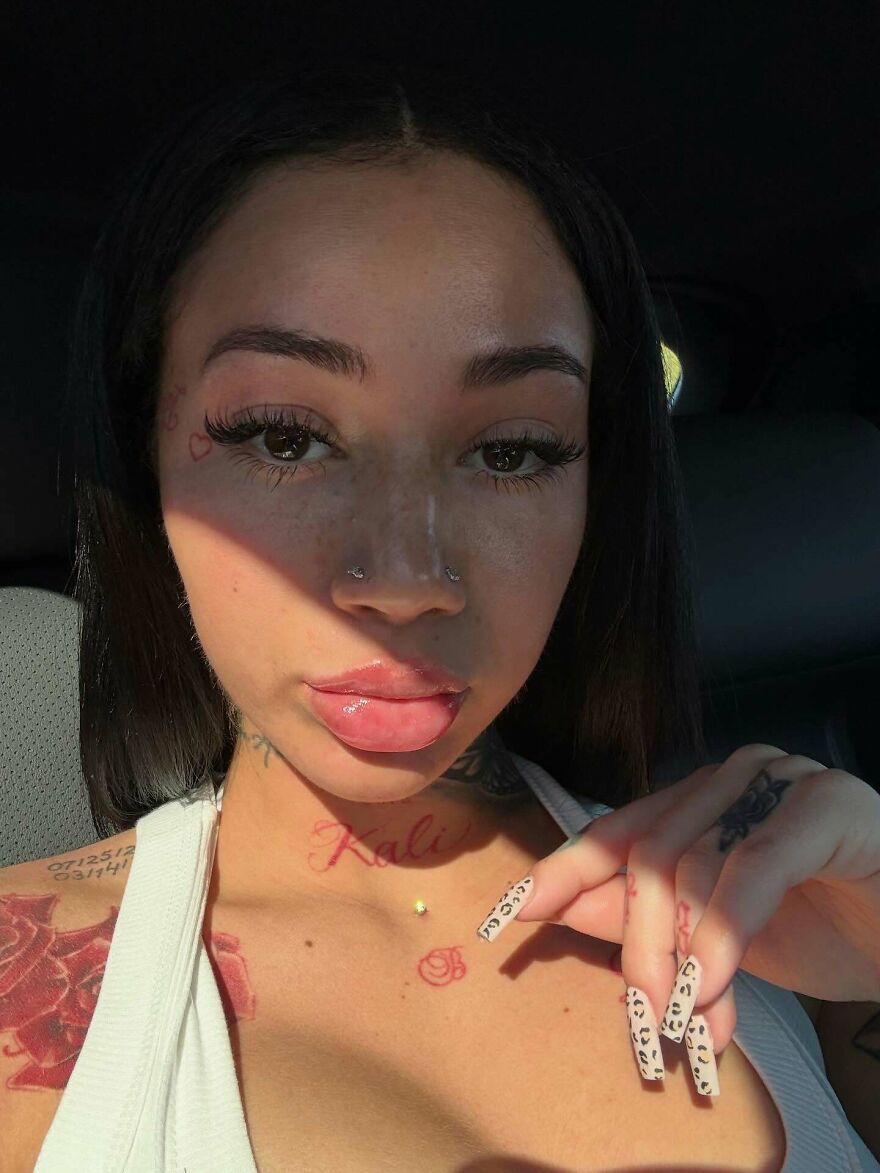 Bhad Bhabie close-up selfie showing tattoos and animal print nails, symbolizing net worth pop culture influence in 2025.