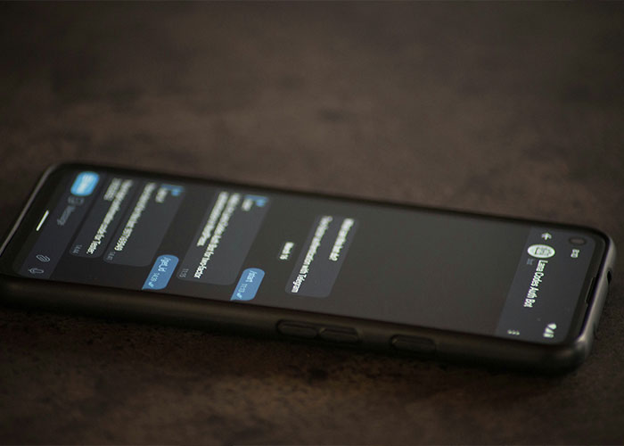 Smartphone displaying text messages, symbolizing trainee police officer revealing inside secrets to dealer boyfriend. Smartphone displaying text messages, symbolizing trainee police officer revealing inside secrets to dealer boyfriend.
