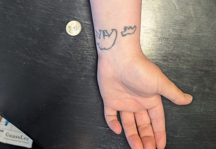 Forearm tattoo of a small bear and paw outline, an unusual design among tattoos allowed on bodies for life.