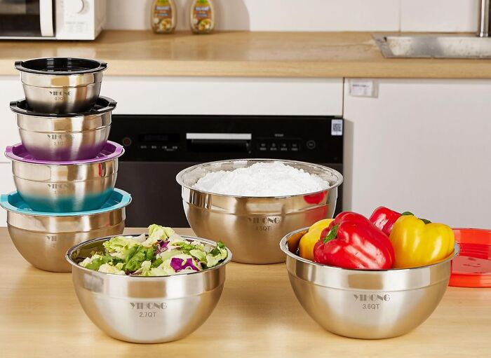 Your Entire Collection Of Mismatched Tupperware With Missing Lids Is About To Be Very Jealous Of This 7 Piece Metal Mixing Bowls With Lids Set