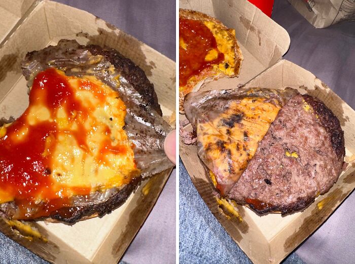 Burger with melted cheese and ketchup served without a bun in a cardboard box, showcasing zero common sense food fail.