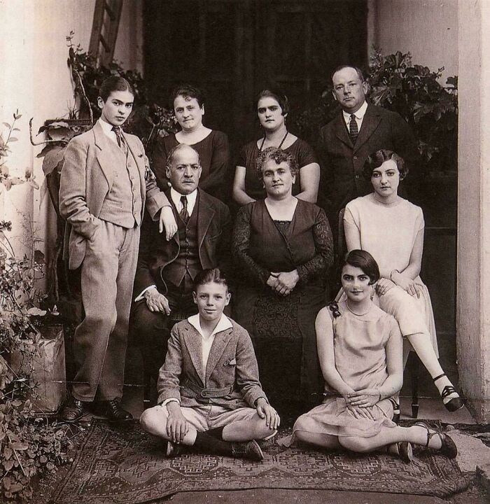 Vintage family portrait featuring multiple generations in formal attire, a unique historical photo with a deep backstory.