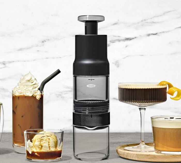 Modern kitchen gadget with drinks including iced coffee with whipped cream and cocktails on marble countertop showcasing new kitchen finds.