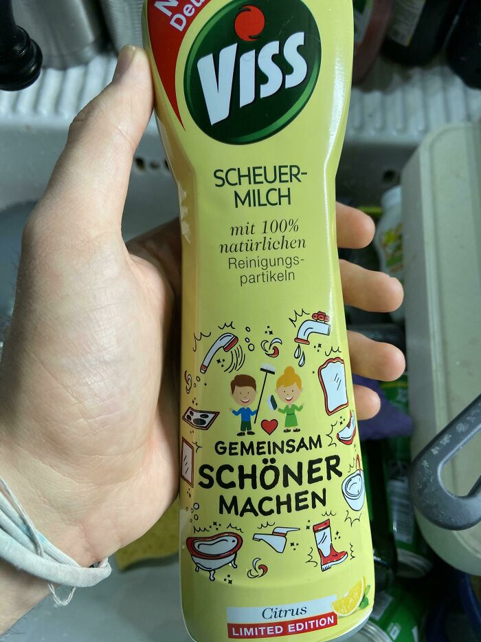 Hand holding misleadingly packaged Viss cleaning product with bright graphics and limited edition citrus label.