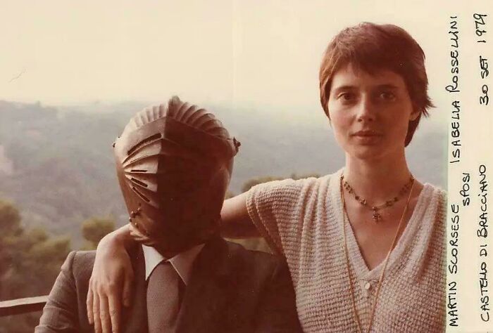 Vintage photo of a woman with a man in a medieval helmet, showcasing unique historical photos with deep backstory.