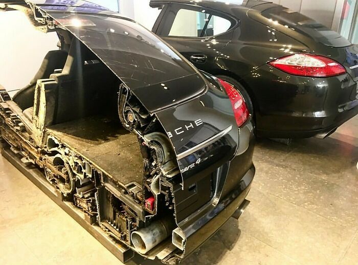 Cutaway view of a Porsche car revealing detailed internal components and structure of the vehicle.