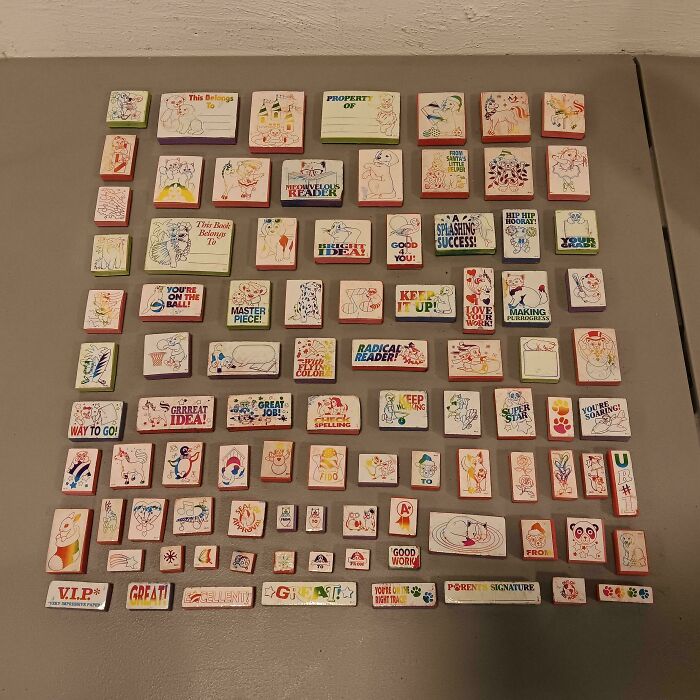 Collection of knolled colorful educational stamps arranged neatly on a table satisfying order and organization needs