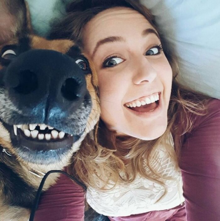 Happy woman and her dog taking a funny selfie together, showcasing animals who can take a better selfie than you.