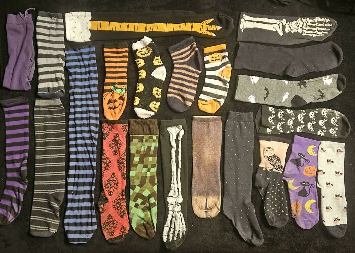 Various colorful patterned socks neatly arranged in rows, illustrating satisfying organization and knolled order.