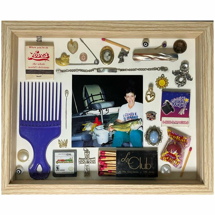 Neatly arranged vintage objects and a photo displayed in a framed knolled composition satisfying need for order.