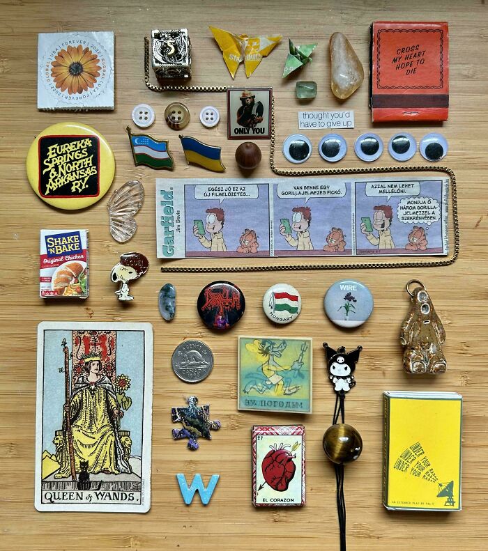 Neatly arranged collection of small objects and pins satisfying need for order and knolled organization.