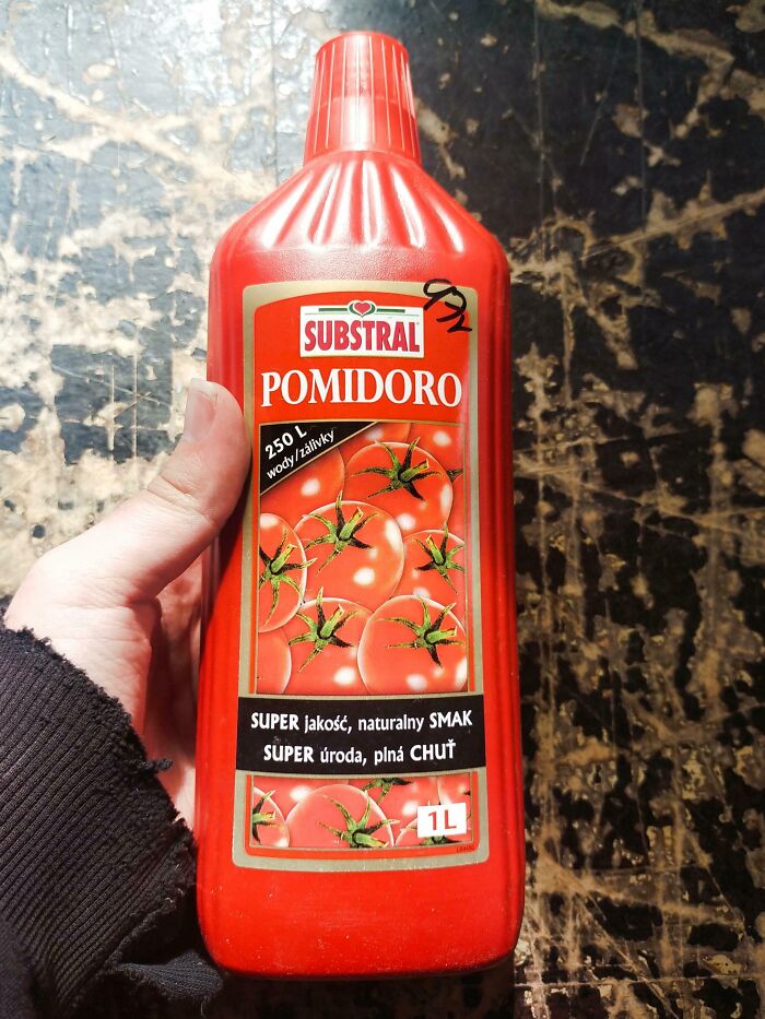 Bottle labeled with tomatoes misleadingly packaged as tomato juice or product, highlighting misleading packaging by companies.
