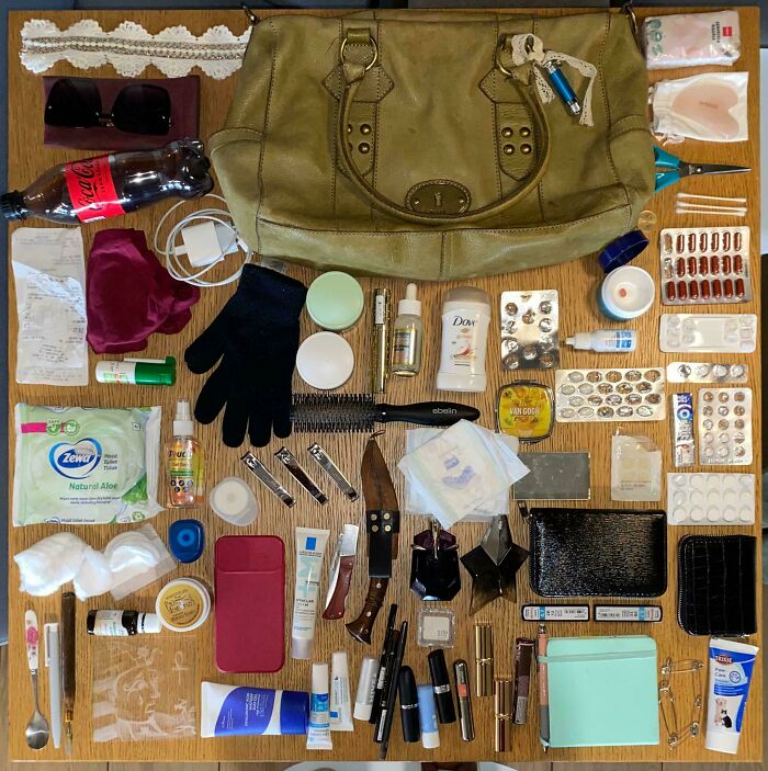 Flat lay of neatly organized everyday items and personal care products showcasing satisfaction in all things knolled and order.