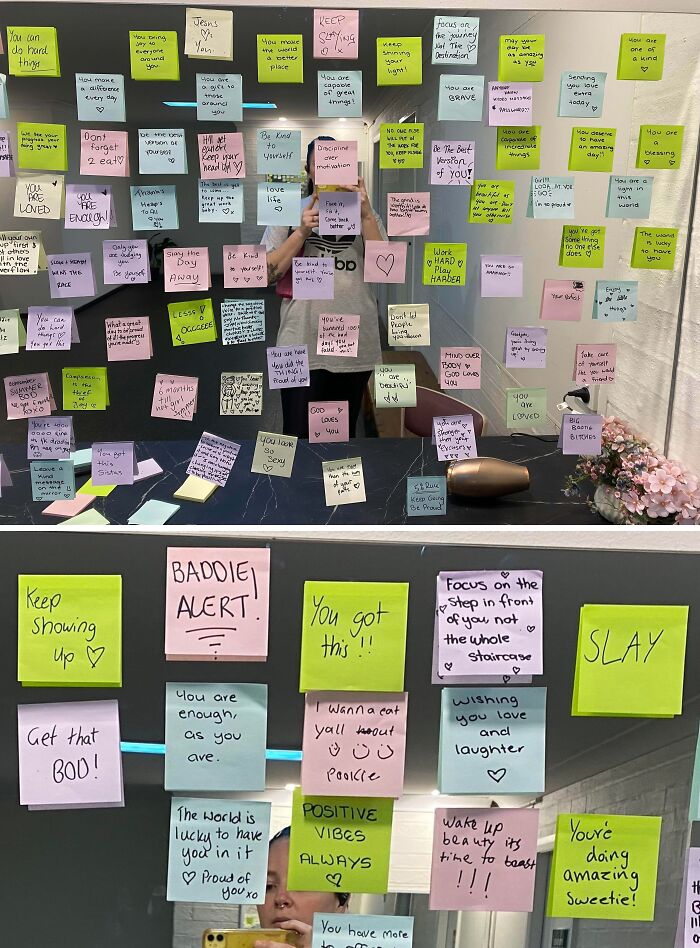 Colorful sticky notes with positive messages on a mirror, showcasing faith in humanity and kindness from strangers.