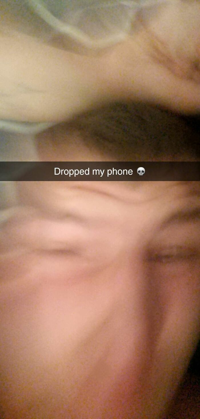 Blurry frozen frame of a person squinting with hand on face, capturing the moment without showing the aftermath.