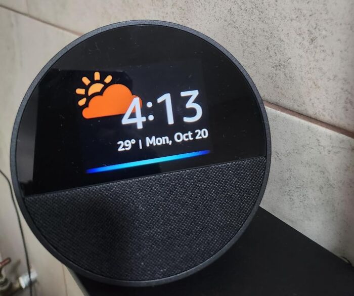 Smart home device displaying time and weather, ideal for finding the best 11.11 deals for lucky shoppers.