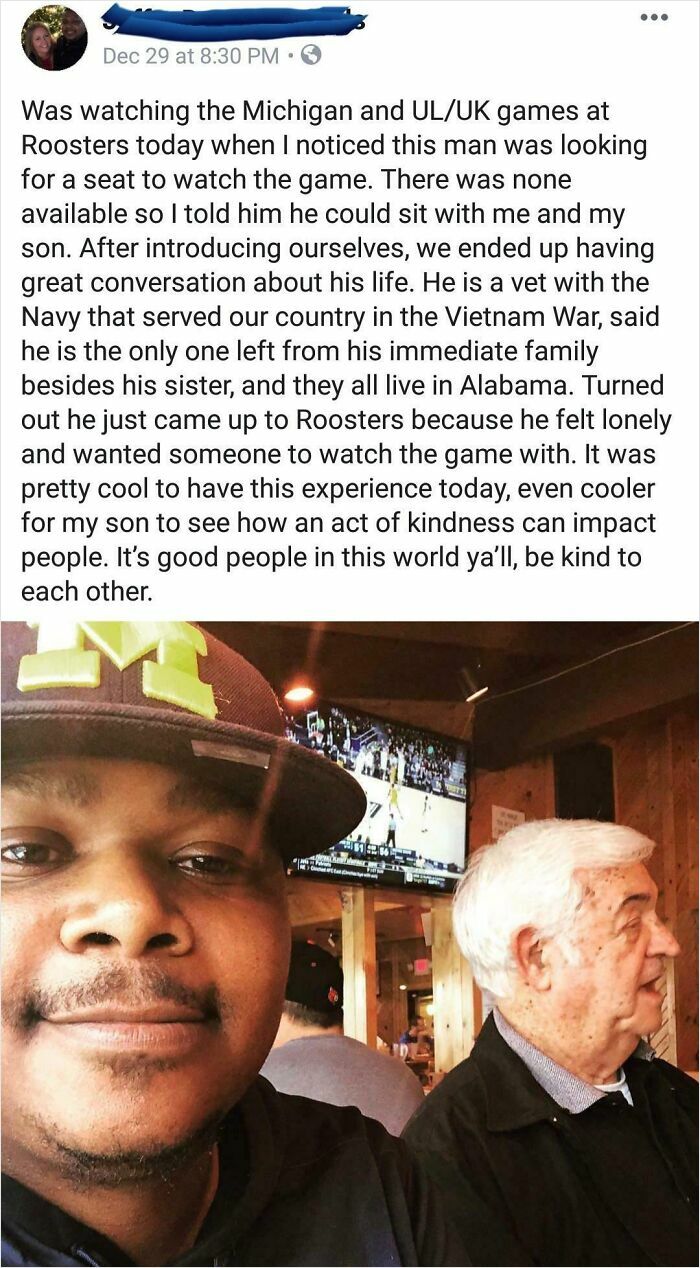 Two strangers sitting together watching a basketball game, showing an act of kindness and faith in humanity restored.